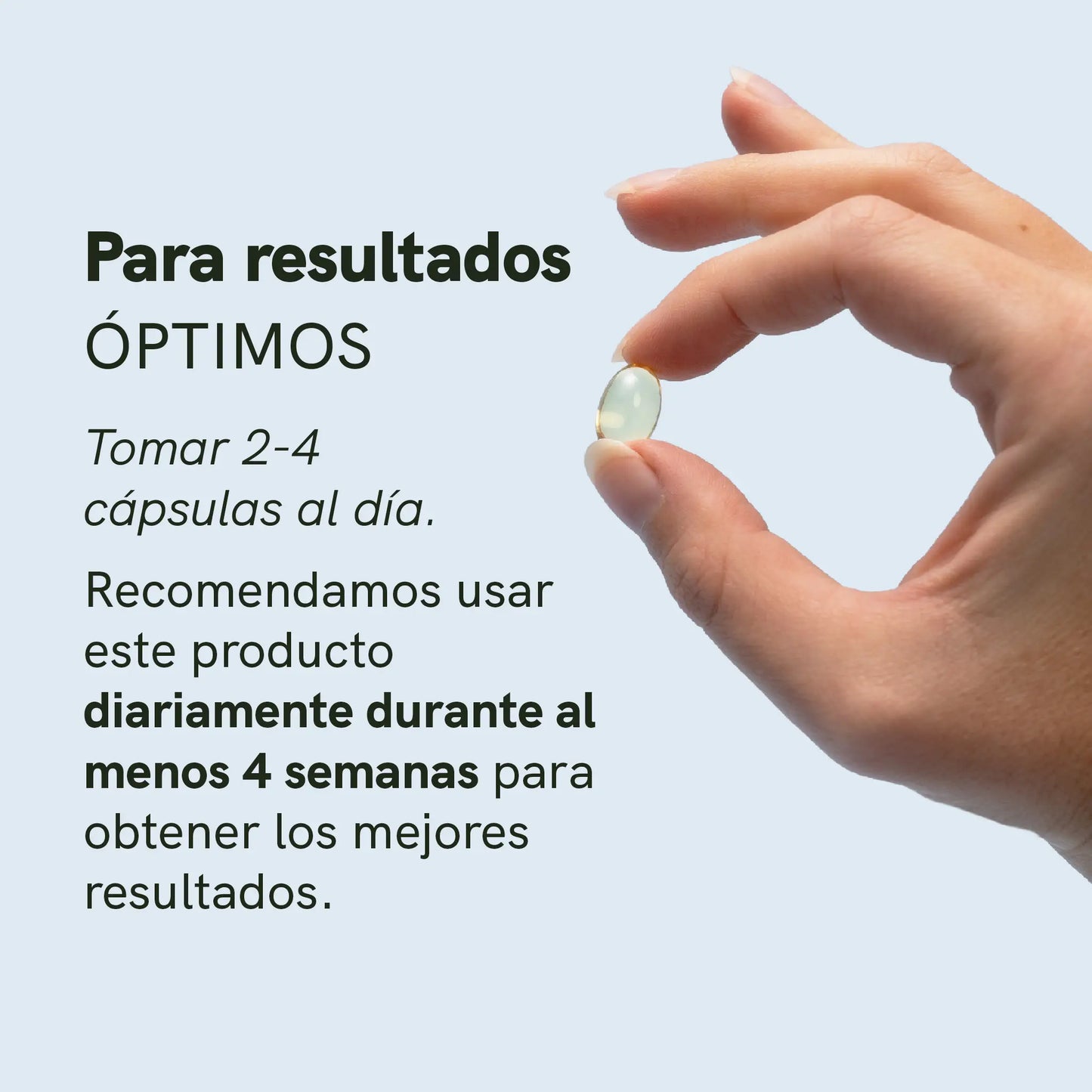 Primer plano de una mano sosteniendo una cápsula blanda de gel verde translúcida.