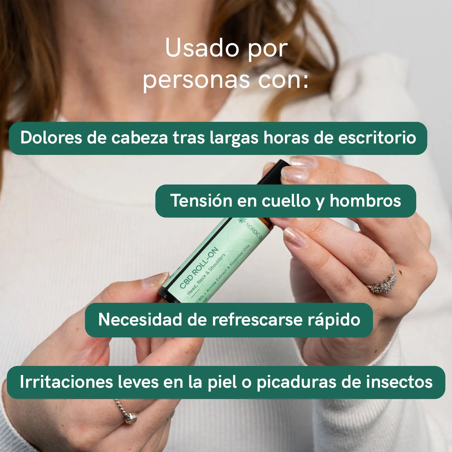 Frasco de CBD Roll-On sostenido por una persona en primer plano.